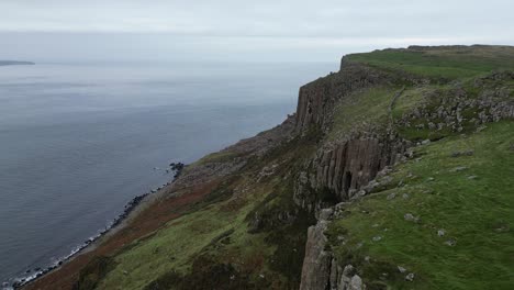 Aerial-view-of-beautiful-cliffs-of-Fair-Head-cliffs-in-Northern-Ireland-overlooking-the-pristine-nature-and-unique-destination-for-an-adventure-for-hikers-and-climbers