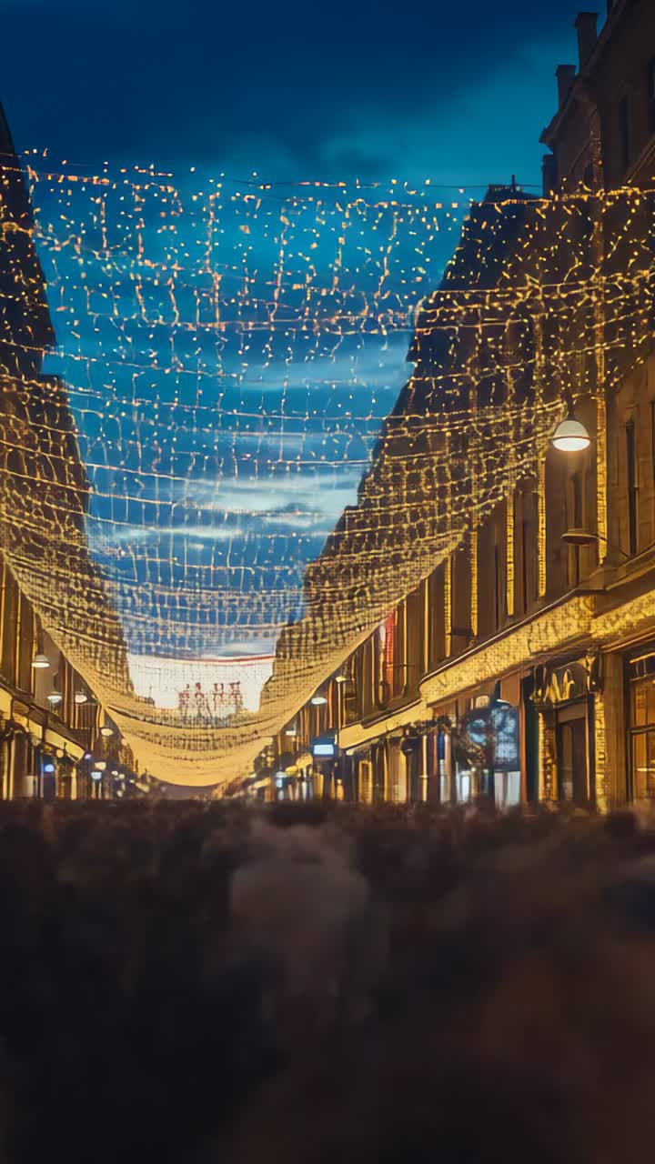 Vertical video: Filling crowd strolling along shopping street as dusk falls under string lights
