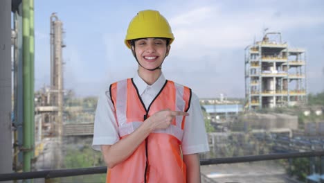 happy indian female architect explaining the work to employees