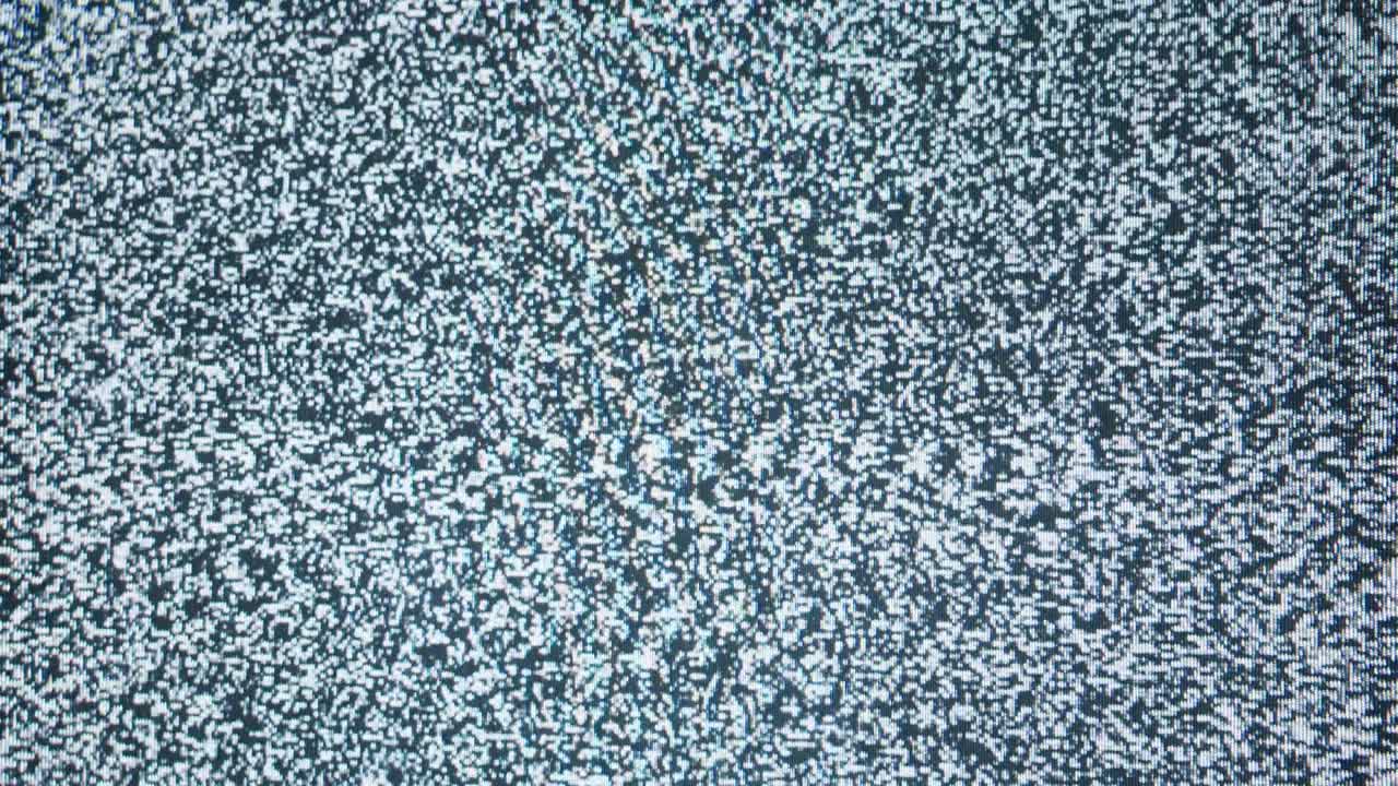 Old retro television screen with ripples, wavy flowing damaged signal. Close-up of broken old-fashioned TV with noise, bad signal reception, cinematography concept