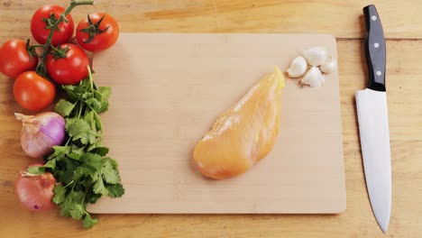 preparing raw chicken breast for cooking