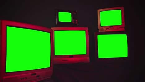 five old tv sets turning off green screens and retro tv stack. zoom in. night tone.