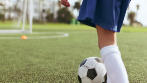 sports legs, ball and soccer child shooting