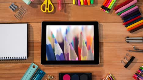 animation of a digital tablet showing multiple crayons on the screen