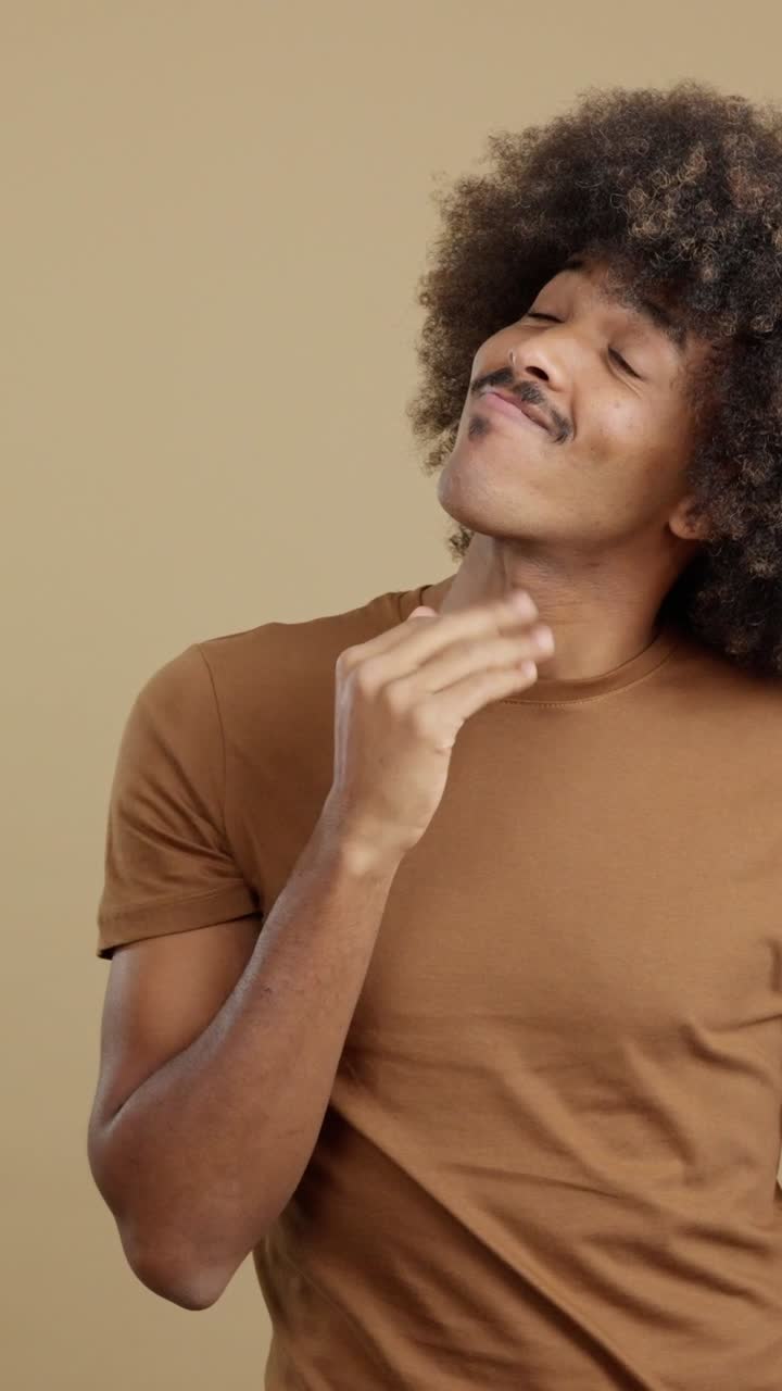 A man with an afro and mustache displaying various emotions and expressions