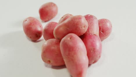 red potatoes placed on white background 4k 4k