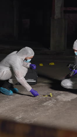 crime scene investigation: forensic team collecting evidence