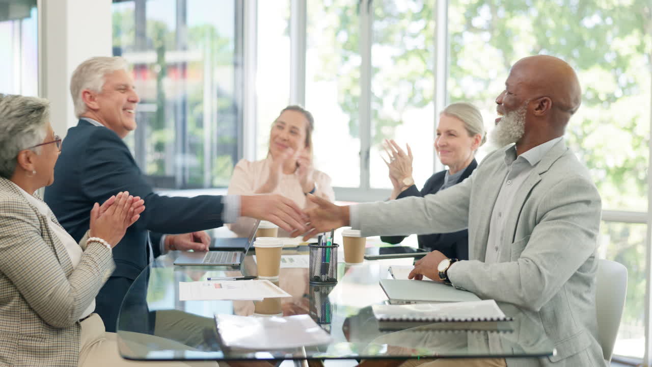 Partnership handshake, applause