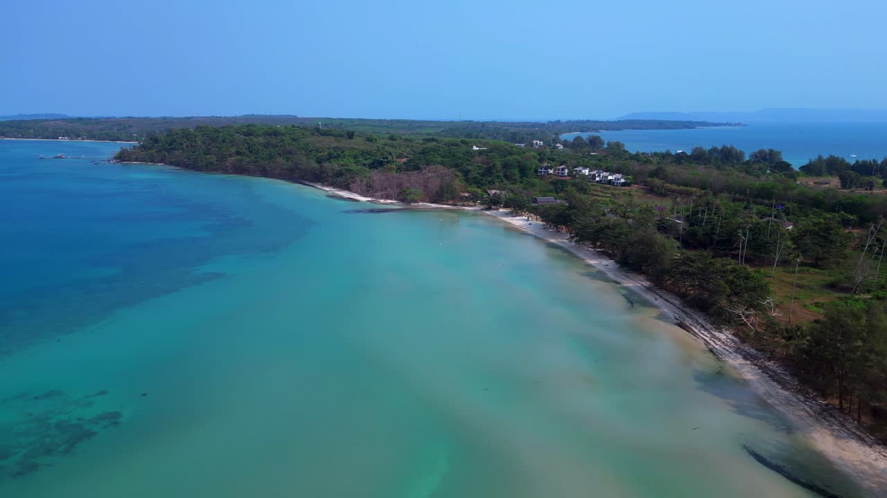 Koh Mak tropical beach meeting turquoise water under blue sky in Thailand. Amazing aerial view flight overflight flyover drone