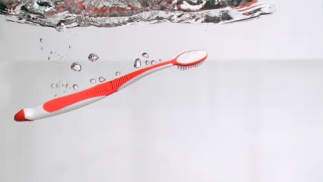 Toothbrush-in-super-slow-motion-dropping