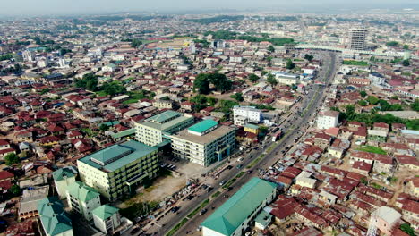 abeokuta town in nigeria's ogun state in west africa - aerial establishing shot with pull back flyover