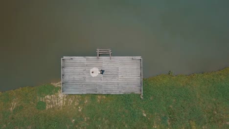 Groom-with-bride-near-lake-in-the-park.-Wedding-couple.-Aerial-shot