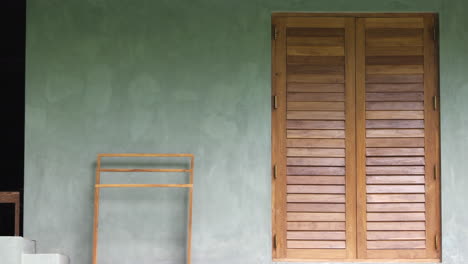 wooden exterior of a window frame in a concrete wall of house