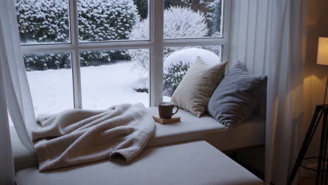 cozy winter window seat with snow