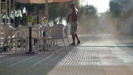 Worker-washing-street-in-the-morning