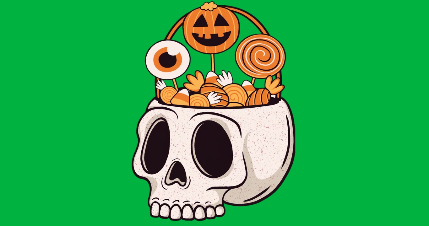 Designer che creano opere d'arte di ciotole a teschio di Halloween, con dolcetti su sfondo trasparente