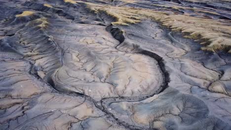 Rough-surface-of-Factory-Butte-summit-in-wild-valley