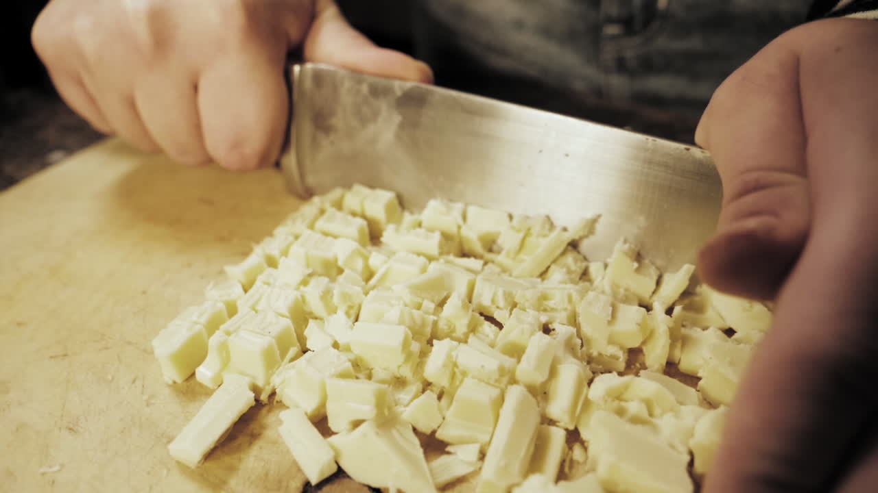 Slow Motion of female hands preparing chocolate cookies.
