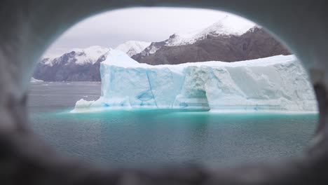 Huge-Iceberg-in-Cold-Water-of-Arctic-Circle,-View-From-Cruise-Ship