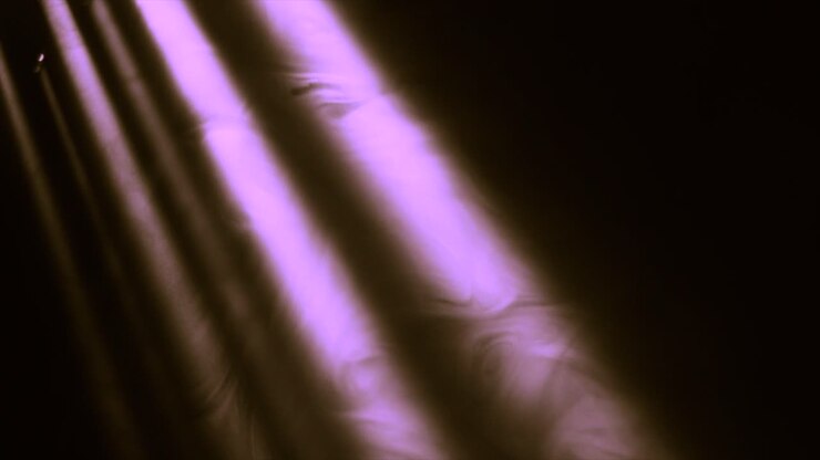 Altissima qualità, raggi di luce in movimento, animazione in loop con bagliore ottico dell'obiettivo.