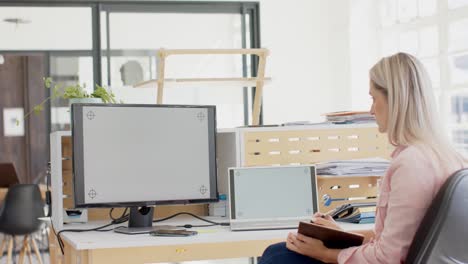 happy caucasian businesswoman having laptop video call with copy space in slow motion