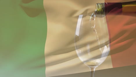 composite of white wine being poured into glass over flag of italy background