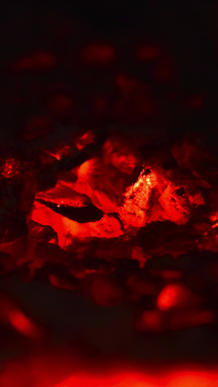 Closeup Glowing Embers On Charcoal, Intense Red Coals In Blacksmith Forge, Dramatic Heat And Molten Pockets