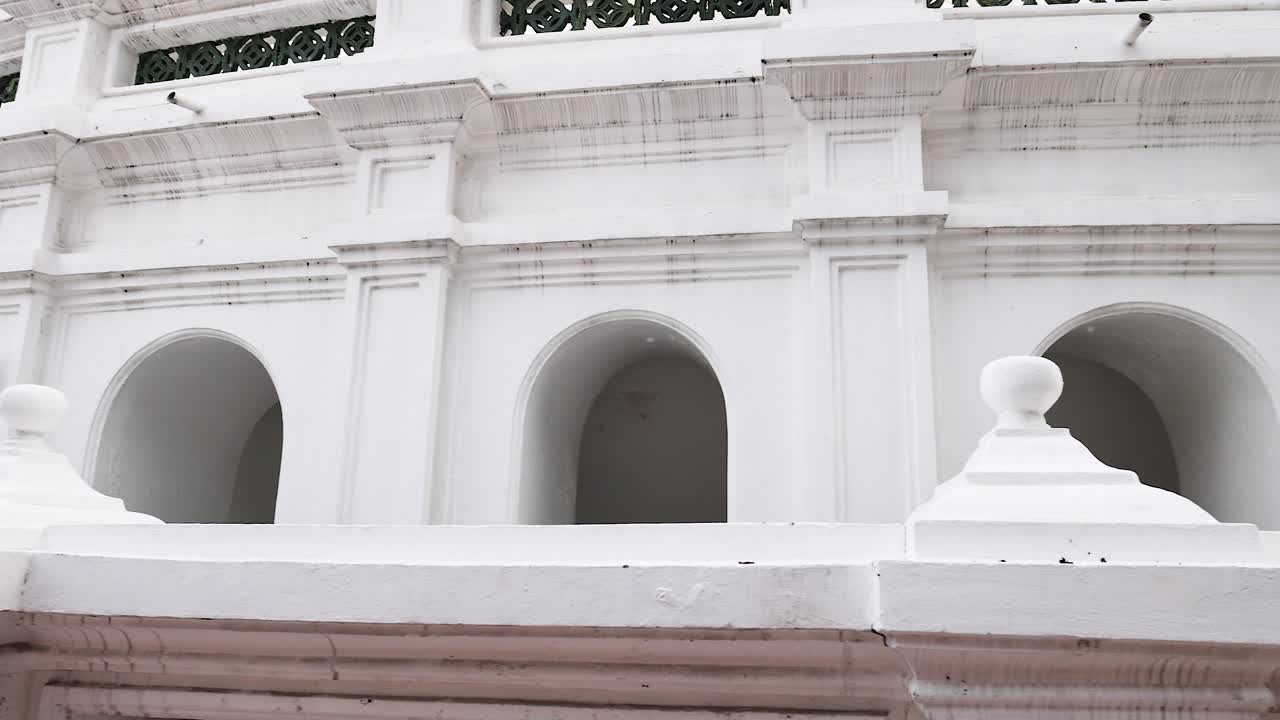 Detailed view of temple's white exterior structure