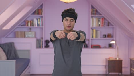 indian man doing wrist rotation exercise