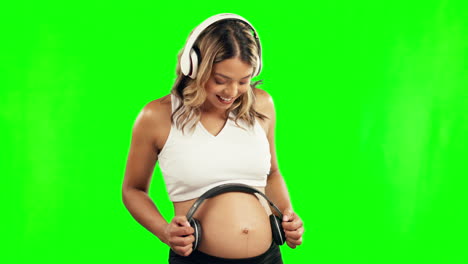 Happy,-pregnant-woman-or-headphones-on-stomach