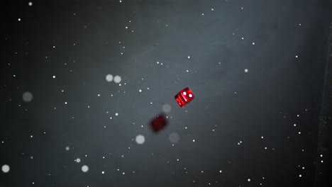 animation of white dots floating over red dice falling and rolling, on black