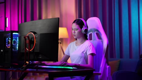 asian teen girl gamer lose while playing video game on computer