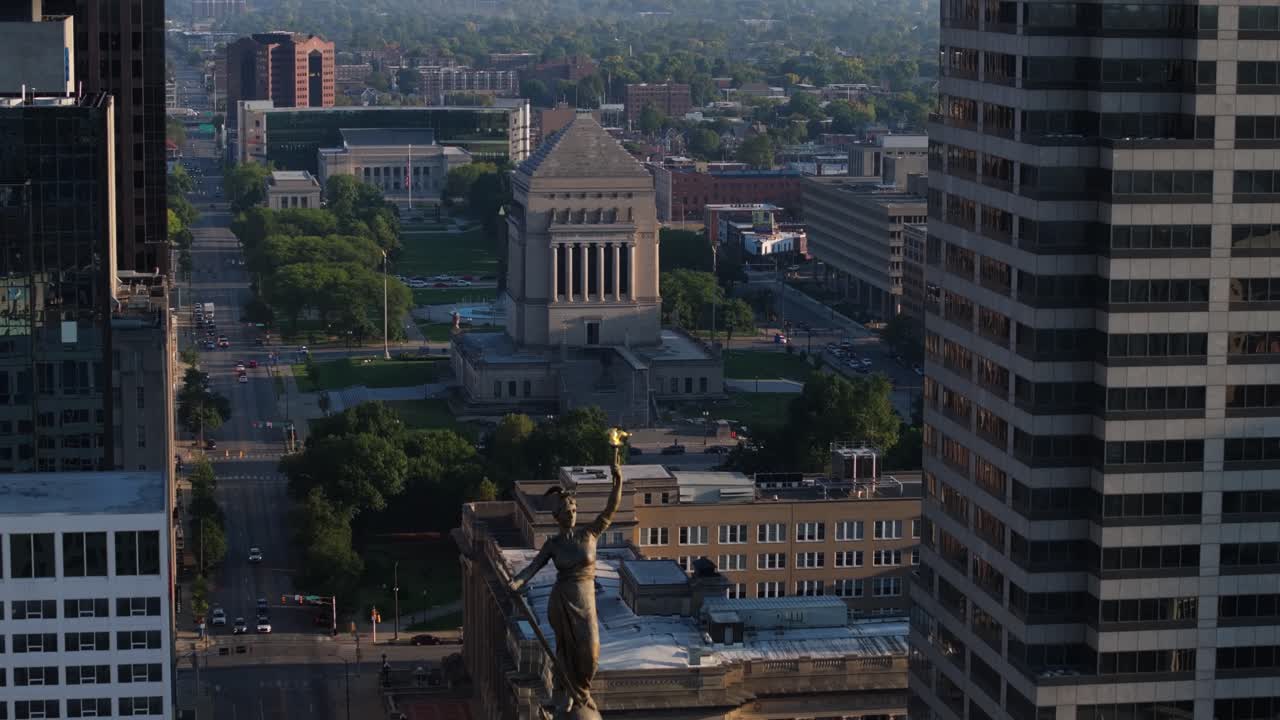 Amazing Drone Shot Above Lady Victory Monument Circle in Downtown Indianapolis. Indiana War Memorial and Museum in Background