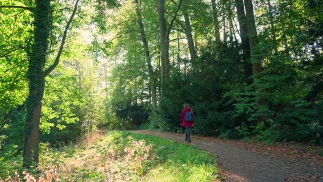 backpack on and heading off through the forest