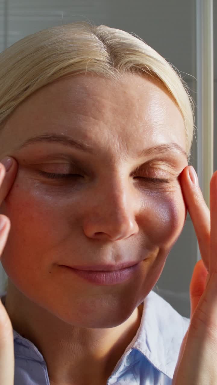 Woman Applying Eye Cream