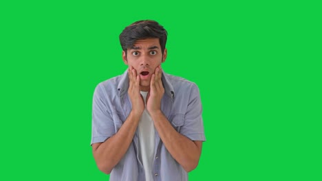 shocked and scared young indian boy green screen