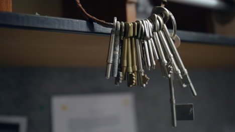 a big bunch of old keys hanging on a keyring