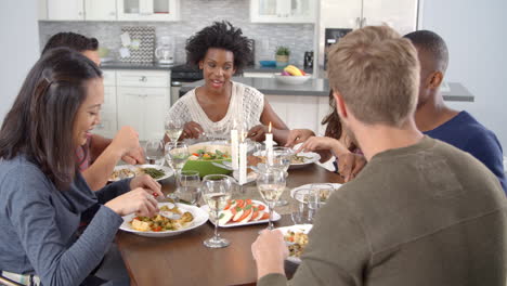 friends talking and eating at a dinner table, shot on r3d