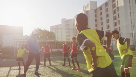 soccer kids exercising in a sunny day