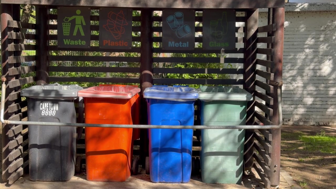 Wheelie Bins for recycling waste, bottles, cardboard and organic waste.