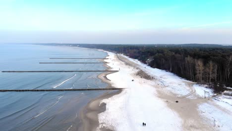 Aerial-shot-of-sandy-beach-in-Ustka-in-winter