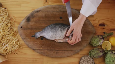 chef cutting a fish