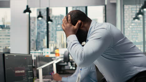 trader in office alerted by hacking alert on trading platform dashboard