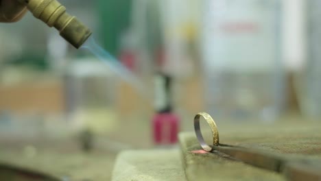 close ups of a craftsman making jewellery in a workshop