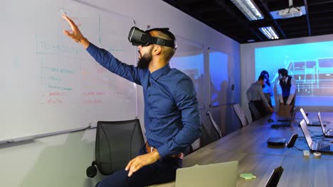 Executive using virtual reality headset in conference room 4k