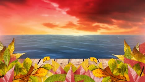 Animation-Von-Herbstblättern-über-Dem-Meer-Und-Orangefarbenen-Wolken-Im-Hintergrund