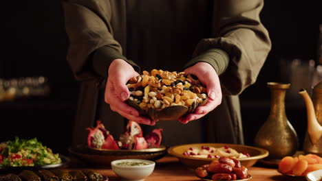 woman holding a bowl of mixed nuts and raisins