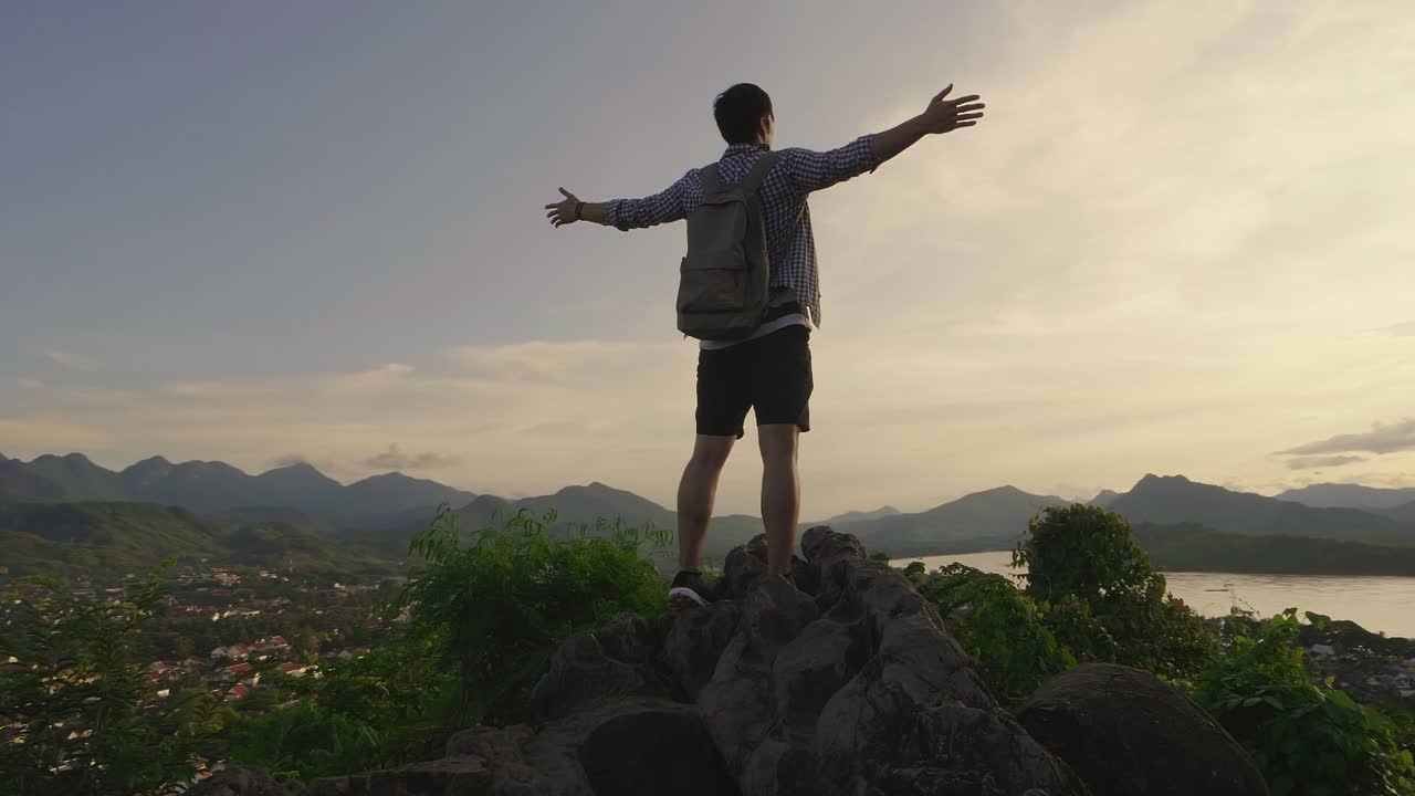 Man enjoying a view from a mountaintop