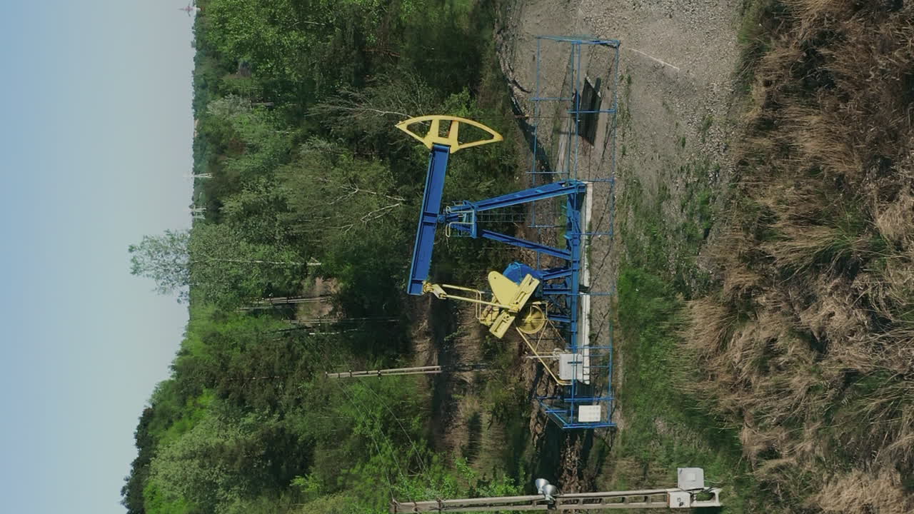 Vertical View Of A Pumpjack Extracting Crude Oil From An OIlwell