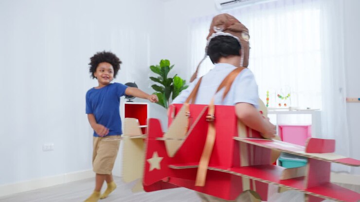 Children Playing with Cardboard Airplanes